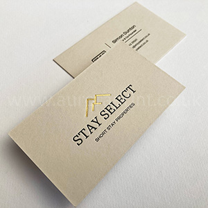 Bespoke business cards with gloss black and gold foil printing.