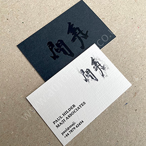 slate and silkweave embossed pristine white business cards with black print and matt black debossed foil.