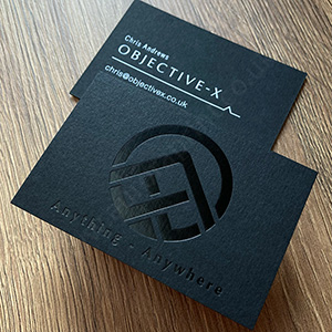 Textured ebony black colorplan card with gloss white and gloss black foil printing.