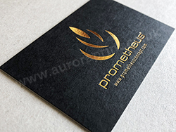 Bright metallic gold foil on a matt black business card