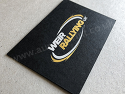 Satin gold and bright white foil on black business cards.