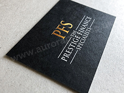 Bright metallic gold and white foil printed on black business cards.