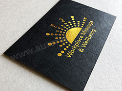 Bright metalic yellow-gold foil on matt black business cards