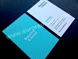 Duplexed business cards with turquoise and white foil print