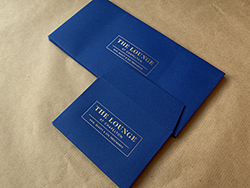 Gold foil print on DL and C7 sapphire colorplan envelopes.