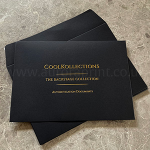 Thick 180gsm black envelopes with bright gold foil printed design.