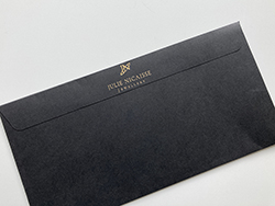 Senses sable black DL envelope with gold foil print.