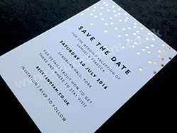 Metallic gold foil and black foil wedding save the date cards.