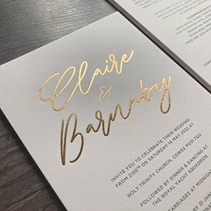 Gold foil printed wedding invitations.