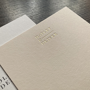 Satin gold foil printed duplexed wedding invitations.