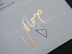 Light gold foil business cards printed on cool grey colorplan
