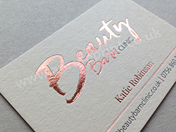 Rose gold foil printed business cards with gloss grey