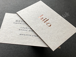 Rose gold business cards on thick grey board - printed for Hilo yoga.