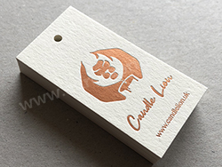 copper hot foil printed swing tags on natural colorplan card