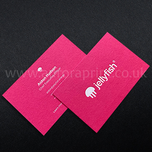 Hot pink business cards with white foil printing.
