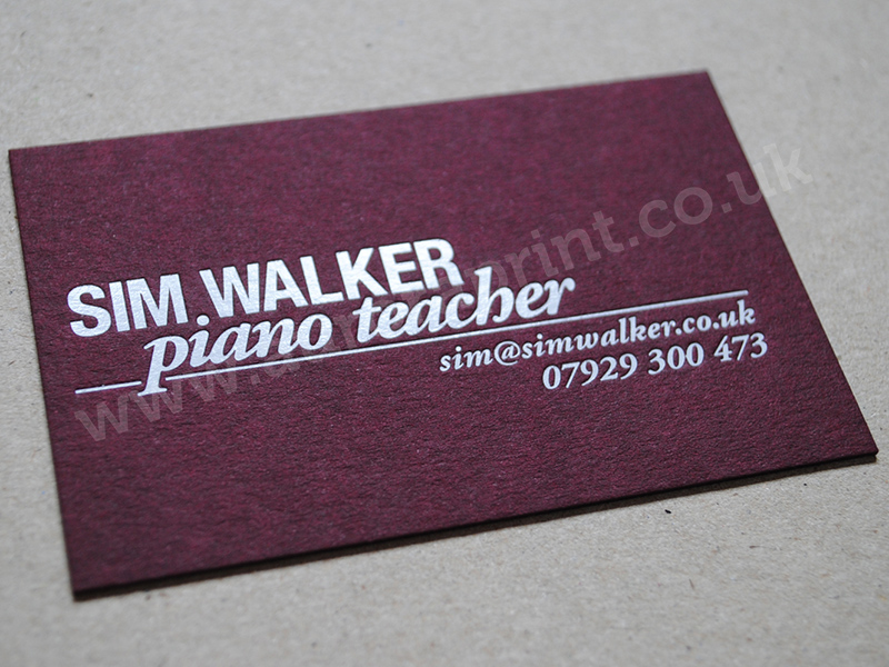 White foil business cards printed on claret colorplan