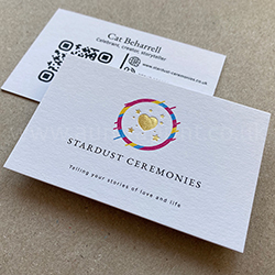 gold foil business cards on a pristine white uncoated card.