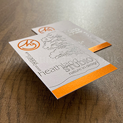Bright copper foil printed logo and design with colour print on white card.
