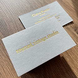 debossed gold foil printed business cards with a satin gold foil