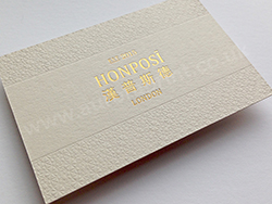 Gold foil business cards with bespoke embossing.