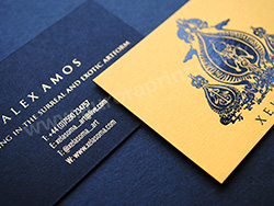 Gold and black foil printed business cards on duplexed ebony/citrine colorplan.