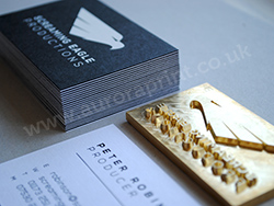 Duplexed black and white business cards with white and black foil printing.