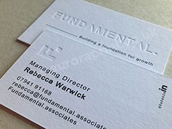 Blind debossed business cards with black print.