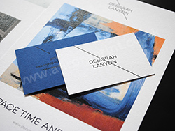 Duplexed cobalt and white colorplan business cards with gloss black foil printing.
