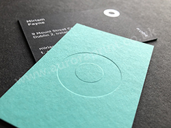 Duplexed black sirio and turquoise colorplan debossed and foil printed business cards.