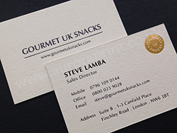 Gold foil business cards with brown gloss foil print.