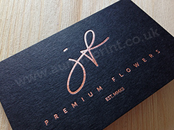 Rose gold business cards on black card colorplan stock.