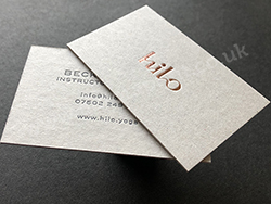 Rose gold and gloss dark grey foil printed business cards.