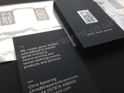 Graphite cairn business cards printed with satin silver foil.