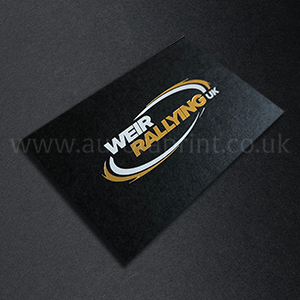 Satin gold and bright white foil on black business cards.